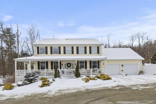 view of front of house with a garage and covered porch