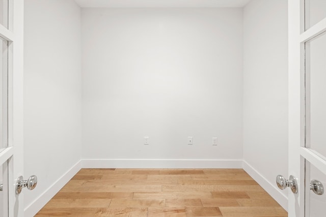 spare room with hardwood / wood-style floors