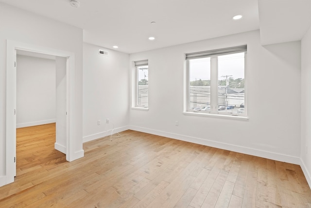 unfurnished room featuring light hardwood / wood-style floors