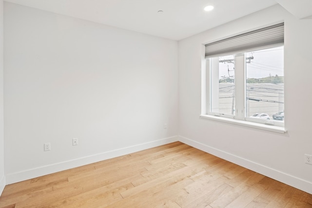 spare room with light wood-type flooring