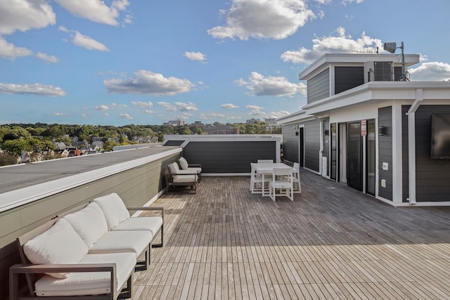 wooden deck featuring outdoor lounge area