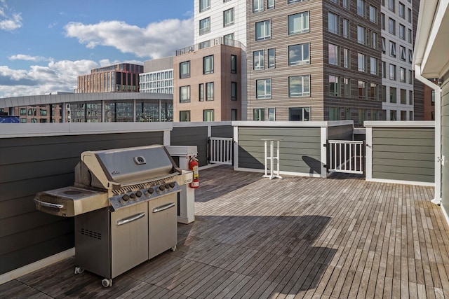 wooden terrace with area for grilling