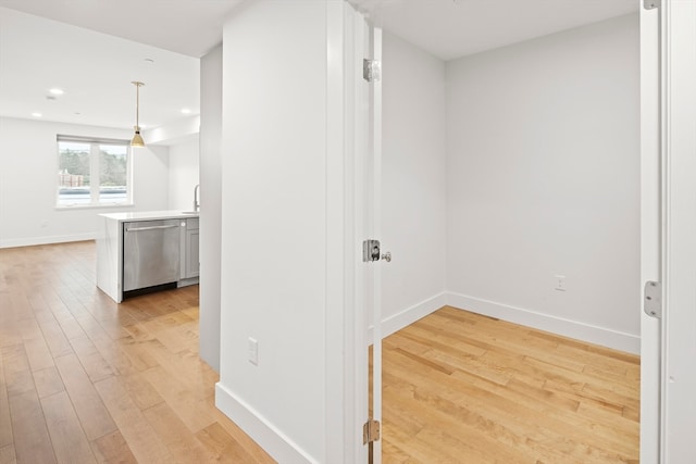 hallway with light wood-type flooring