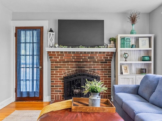 20 Humphrey St, Wakefield, MA 01880 - living area featuring wood finished floors and a brick fireplace
