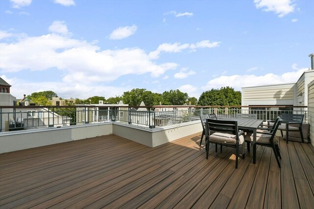 wooden terrace featuring outdoor dining space