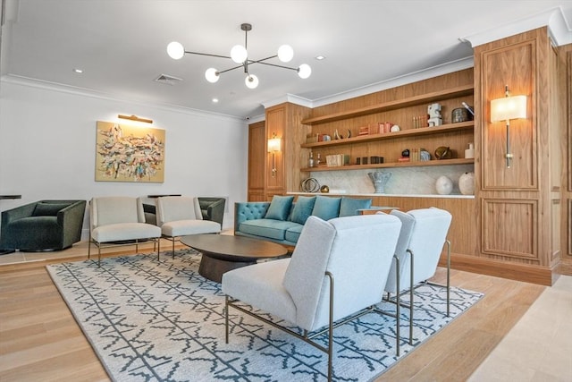 191 Washington St Unit 308, Boston, MA 02135 - living room featuring ornamental molding, a chandelier, and light wood-type flooring