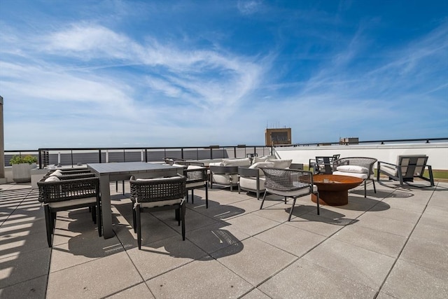 191 Washington St Unit 308, Boston, MA 02135 - view of patio / terrace featuring an outdoor living space with a fire pit and outdoor dining space