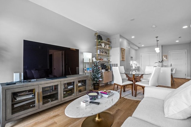 191 Washington St Unit 308, Boston, MA 02135 - living room featuring light wood finished floors and recessed lighting