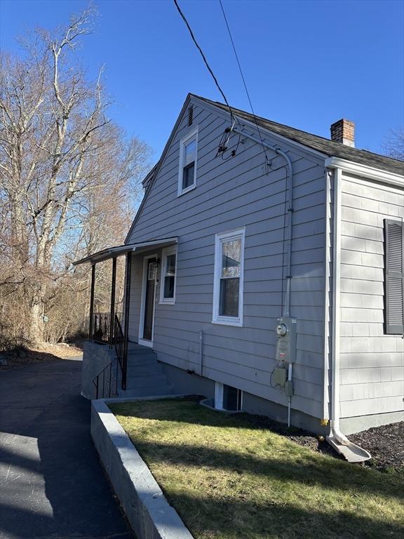 view of home's exterior featuring a yard