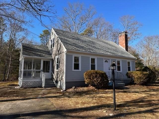 view of front of property with a sunroom