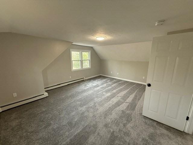 bonus room featuring lofted ceiling, carpet floors, and a baseboard radiator