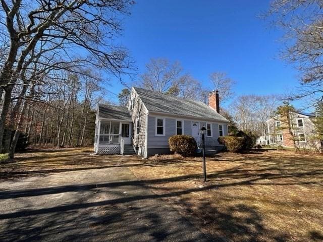 view of front of property featuring a sunroom