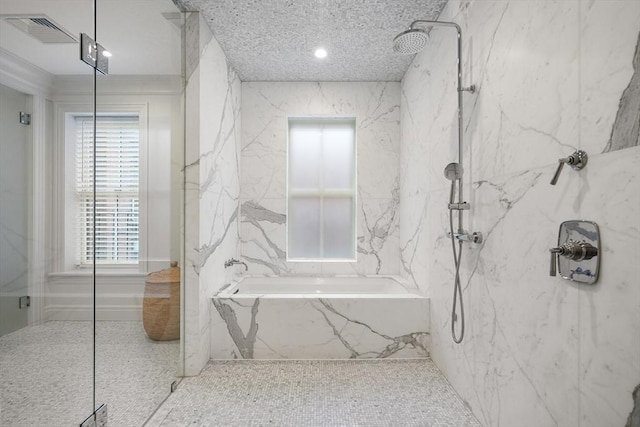 bathroom featuring shower with separate bathtub