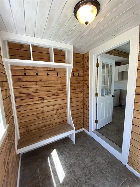 137 Chipaway Rd, Freetown, MA 02717 - mudroom featuring wooden walls, wooden ceiling, and dark tile patterned flooring
