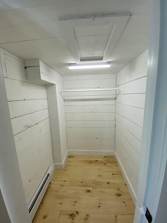 137 Chipaway Rd, Freetown, MA 02717 - interior space with light wood-type flooring, attic access, and a baseboard radiator