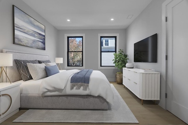 bedroom featuring light wood-style flooring and recessed lighting