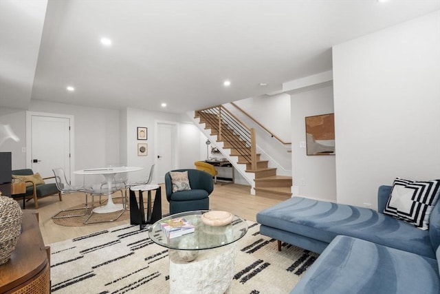 living area featuring stairway, wood finished floors, and recessed lighting