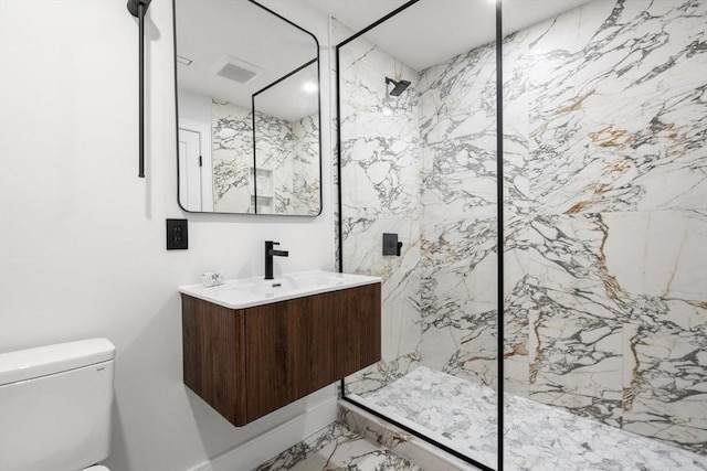 full bathroom with marble finish floor, a marble finish shower, visible vents, toilet, and vanity