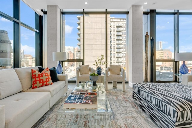 bedroom featuring a wall of windows and a city view