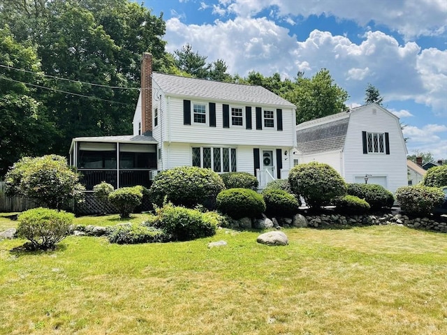 41 Sherrick Ave, Holbrook, MA 02342 - colonial-style house featuring a chimney, a sunroom, a front yard, and a garage