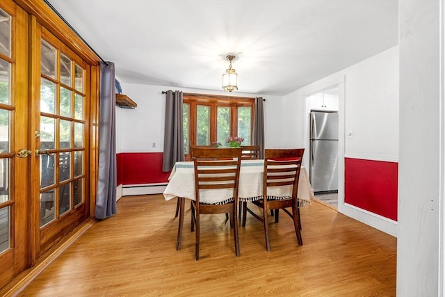 41 Sherrick Ave, Holbrook, MA 02342 - dining area featuring a baseboard heating unit and light wood finished floors