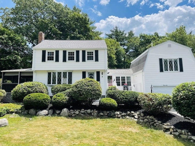 41 Sherrick Ave, Holbrook, MA 02342 - colonial home with a chimney, an attached garage, a front lawn, and roof with shingles