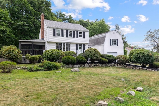 41 Sherrick Ave, Holbrook, MA 02342 - view of front of house featuring a chimney, a sunroom, a front lawn, and an attached garage