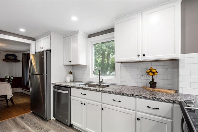 41 Sherrick Ave, Holbrook, MA 02342 - kitchen with stainless steel appliances, stone countertops, light wood-style flooring, white cabinets, and recessed lighting