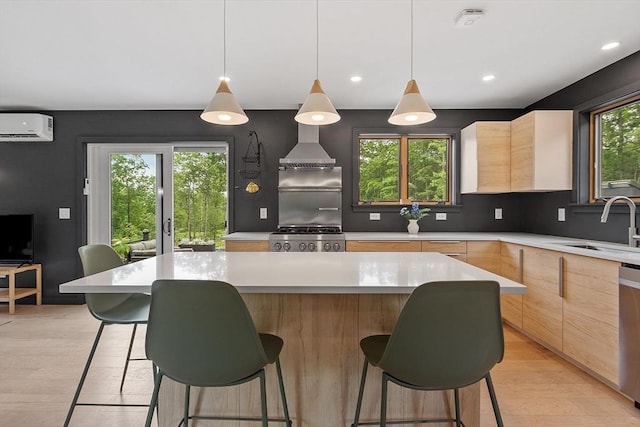 17 Hastings Rd, Ashburnham, MA 01430 - kitchen featuring light brown cabinets, modern cabinets, a wall mounted AC, light countertops, and recessed lighting