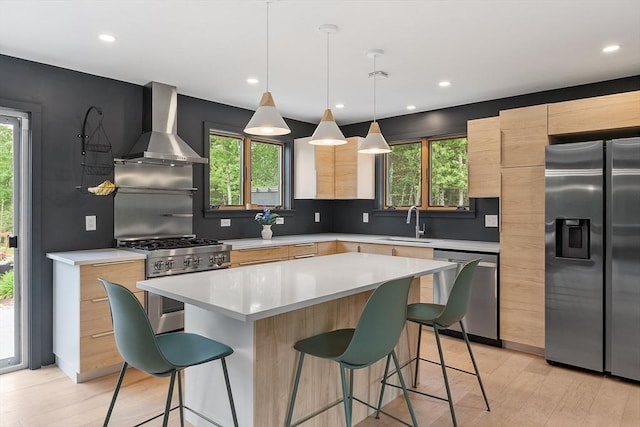 17 Hastings Rd, Ashburnham, MA 01430 - kitchen featuring stainless steel appliances, wall chimney exhaust hood, modern cabinets, light brown cabinetry, and recessed lighting