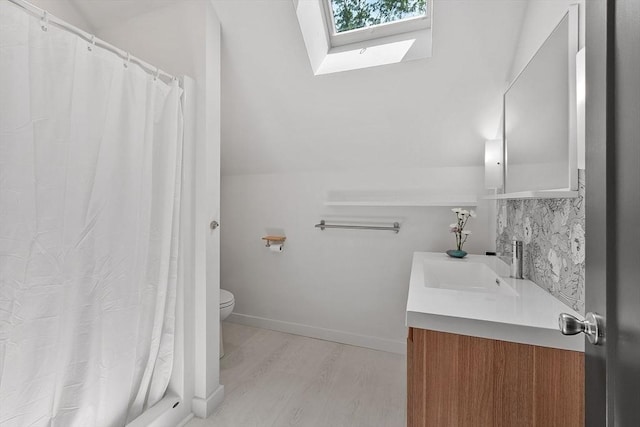 17 Hastings Rd, Ashburnham, MA 01430 - bathroom featuring a skylight, vanity, wood finished floors, and curtained shower