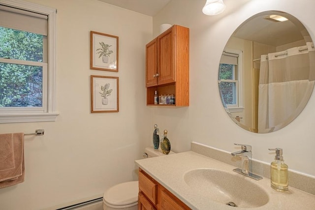 5 Rollie Shepard Dr, Millbury, MA 01527 - bathroom featuring vanity, toilet, a baseboard heating unit, and a shower with curtain