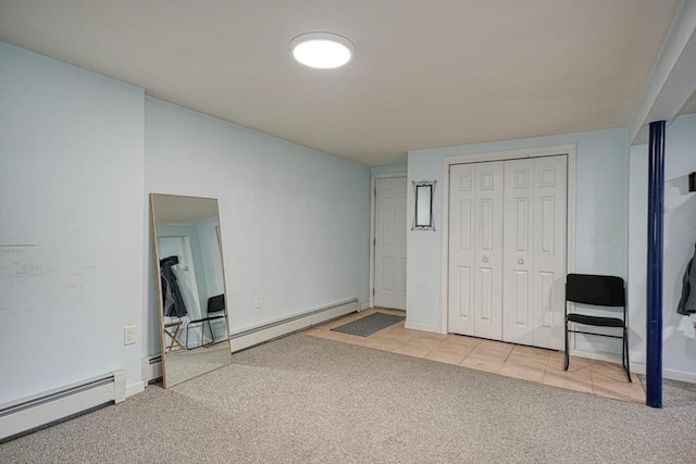5 Rollie Shepard Dr, Millbury, MA 01527 - unfurnished bedroom featuring baseboard heating, carpet floors, a closet, and tile patterned floors