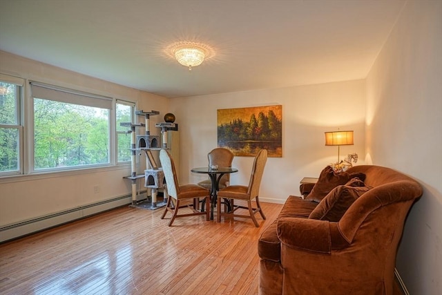 5 Rollie Shepard Dr, Millbury, MA 01527 - living area with baseboard heating, wood-type flooring, and baseboards