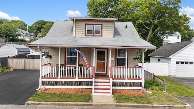 30 Edge Hill Rd, Lynn, MA 01904 - view of front of home featuring a porch, driveway, a garage, and an outdoor structure
