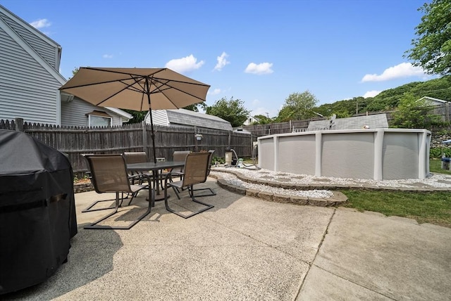 30 Edge Hill Rd, Lynn, MA 01904 - fenced backyard with an outdoor pool, outdoor dining area, grilling area, and a patio area