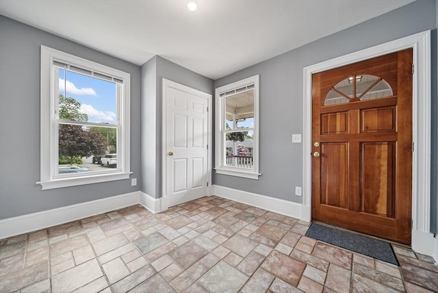 30 Edge Hill Rd, Lynn, MA 01904 - entrance foyer with baseboards, light stone finish flooring, and plenty of natural light