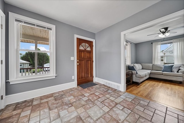 30 Edge Hill Rd, Lynn, MA 01904 - foyer featuring baseboards, ceiling fan, and stone finish flooring