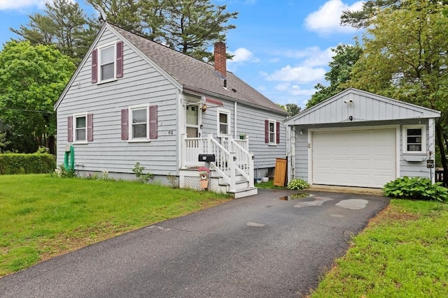 82 Brickel Rd, Stoughton, MA 02072 - view of front of house featuring a chimney, an outbuilding, a garage, a front yard, and roof with shingles