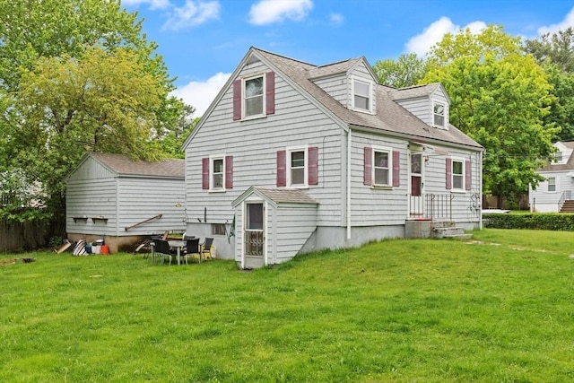 82 Brickel Rd, Stoughton, MA 02072 - rear view of property with a yard and a shingled roof