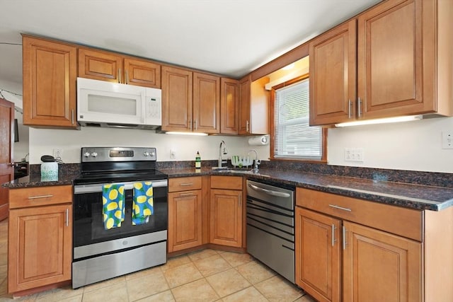82 Brickel Rd, Stoughton, MA 02072 - kitchen featuring stainless steel appliances, a sink, light tile patterned flooring, and brown cabinetry