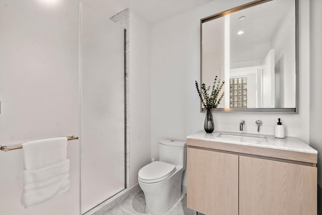 bathroom featuring toilet, marble finish floor, recessed lighting, and vanity