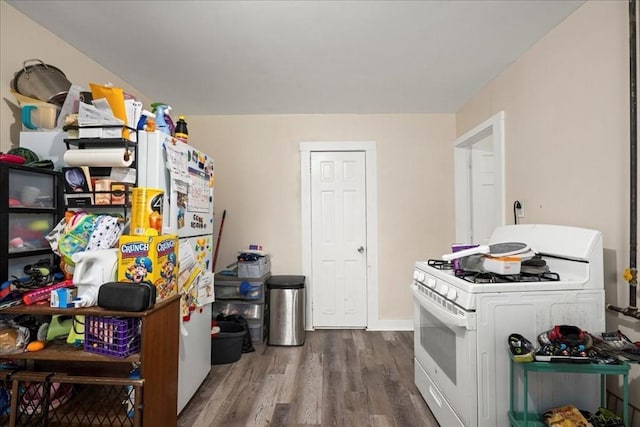 39 Worcester St, Southbridge, MA 01550 - kitchen with white gas range oven and wood finished floors