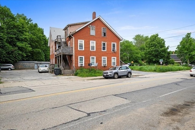 39 Worcester St, Southbridge, MA 01550 - view of home's exterior featuring a chimney and stairs