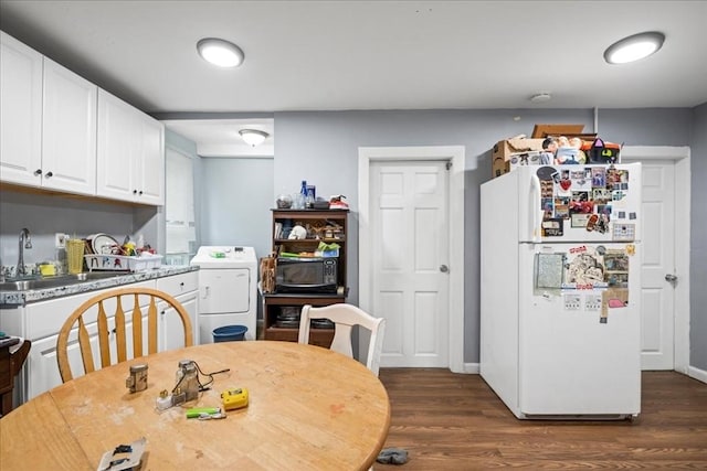 39 Worcester St, Southbridge, MA 01550 - dining room with washer / dryer, dark wood finished floors, and baseboards