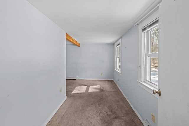 unfurnished room with baseboards, baseboard heating, and carpet