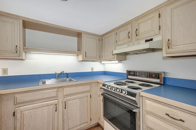 kitchen with white range with electric cooktop, sink, and light brown cabinetry