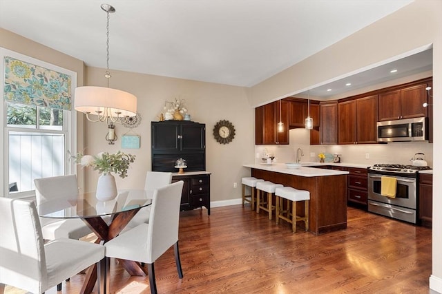 dining room featuring baseboards and dark wood-style flooring