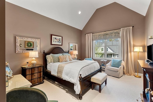 bedroom with carpet floors, high vaulted ceiling, and baseboards