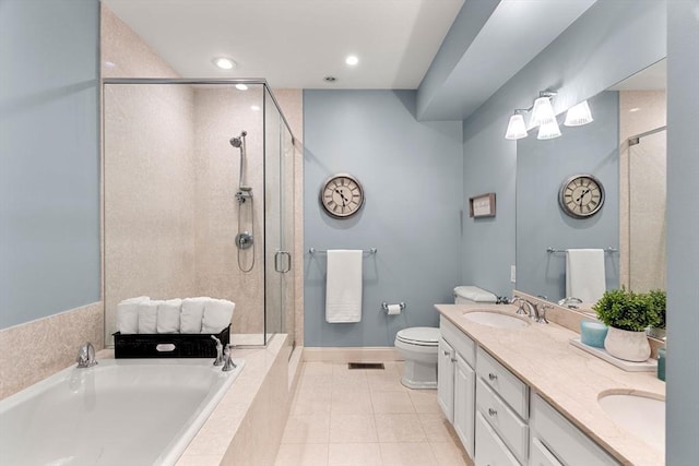 bathroom with a garden tub, tile patterned flooring, double vanity, a shower stall, and a sink